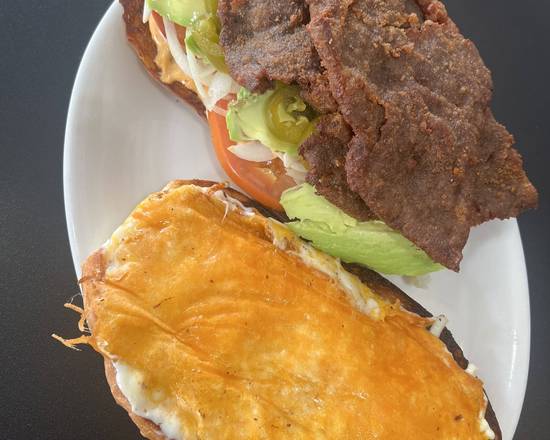 Order Torta de Milanesa/Breaded Fried Steak Sandwich food online from Tavial Grill store, Saint Paul on bringmethat.com