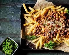 Toma´s papas fritas con carne (León)