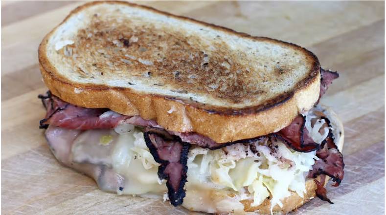 Gus’s Flashback Reuben with pastrami, sauerkraut and melted Swiss on toasted rye.