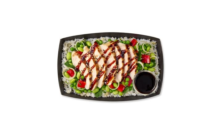 chicken teriyaki on a bed