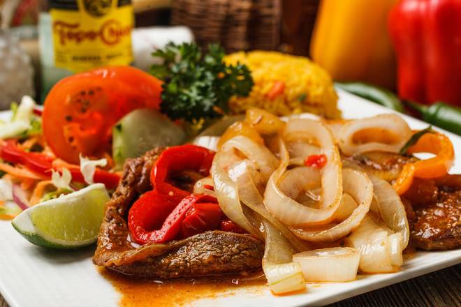 Order Bistec Encebollado (Stewed Steak with Onions) food online from Ideal Market store, Baton Rouge on bringmethat.com