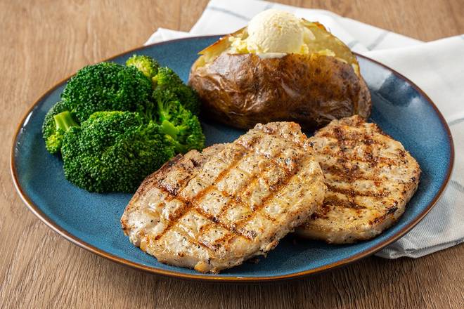 Order Mesquite-Grilled Pork Chops food online from Logan's Roadhouse store, Spring Hill on bringmethat.com