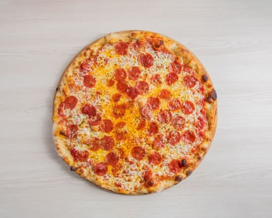 16 inch halal beef pepperoni pizza with melted fior di latte cheese and San Marzano basil sauce