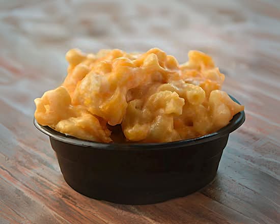A close-up shot of a bowl of creamy mac and cheese.