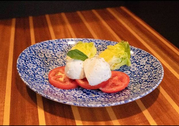 Bufala Mozzarella, Vine Tomato, Basil, Boston wedge, and EVOO