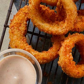Order Jumbo Cajun Seasoned Onion Rings food online from Apps All Around store, Rochester on bringmethat.com