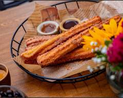 Azúcar Café Y Churros, Casa Origen
