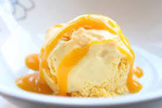 Vanilla Ice-cream topped with Mango Dressing