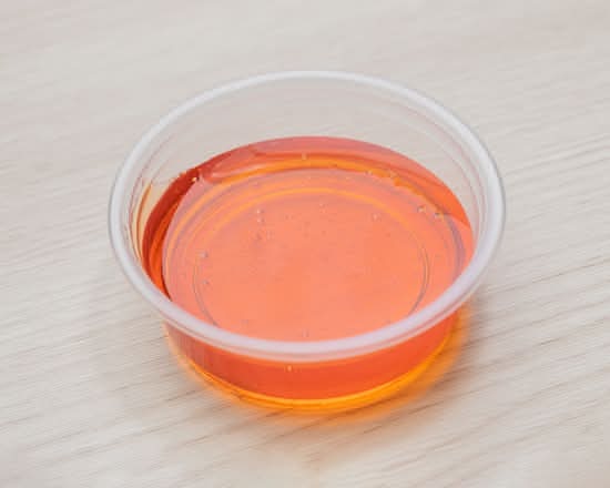 Chili-infused hot honey dip for artisanal pizza crusts