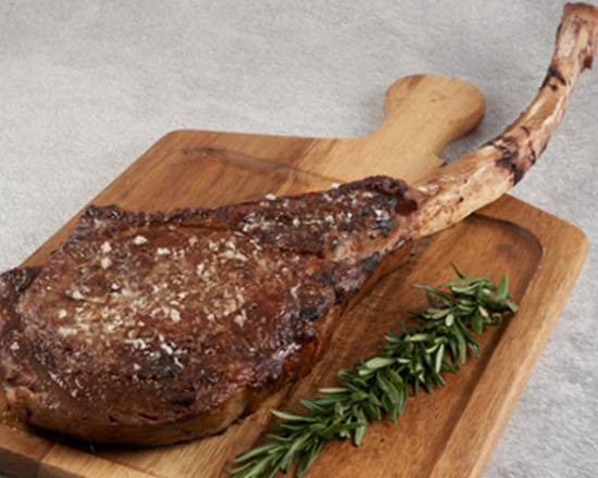 Order Prime Tomahawk Ribeye* 32 oz food online from The Palm (1750 Tysons Blvd. store, McLean on bringmethat.com