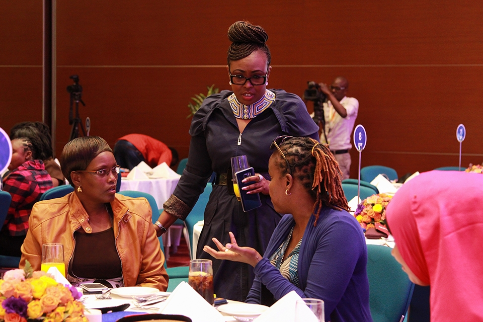 Journalist and Broadcaster, Radio & Print Caroline Mutuko (centre) interacts with Uber Women driver-partners at the Uber's Women Appreciation Luncheon.