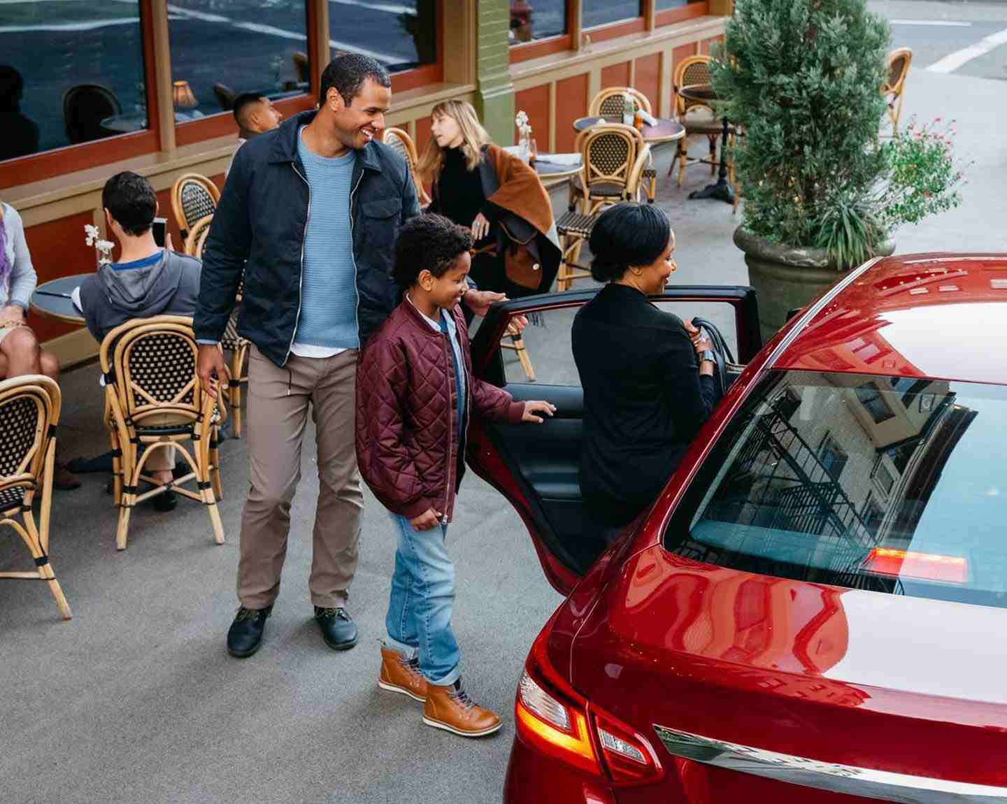 family in the street getting together into a ride